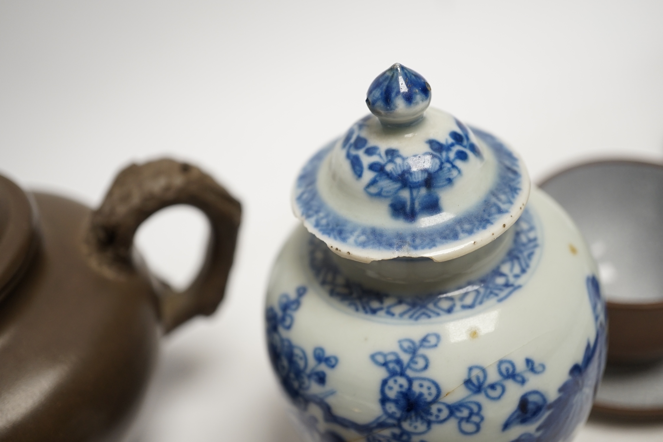 A Chinese blue and white tea caddy, four tea bowls, four cups and saucers and a teapot, largest 17cm high